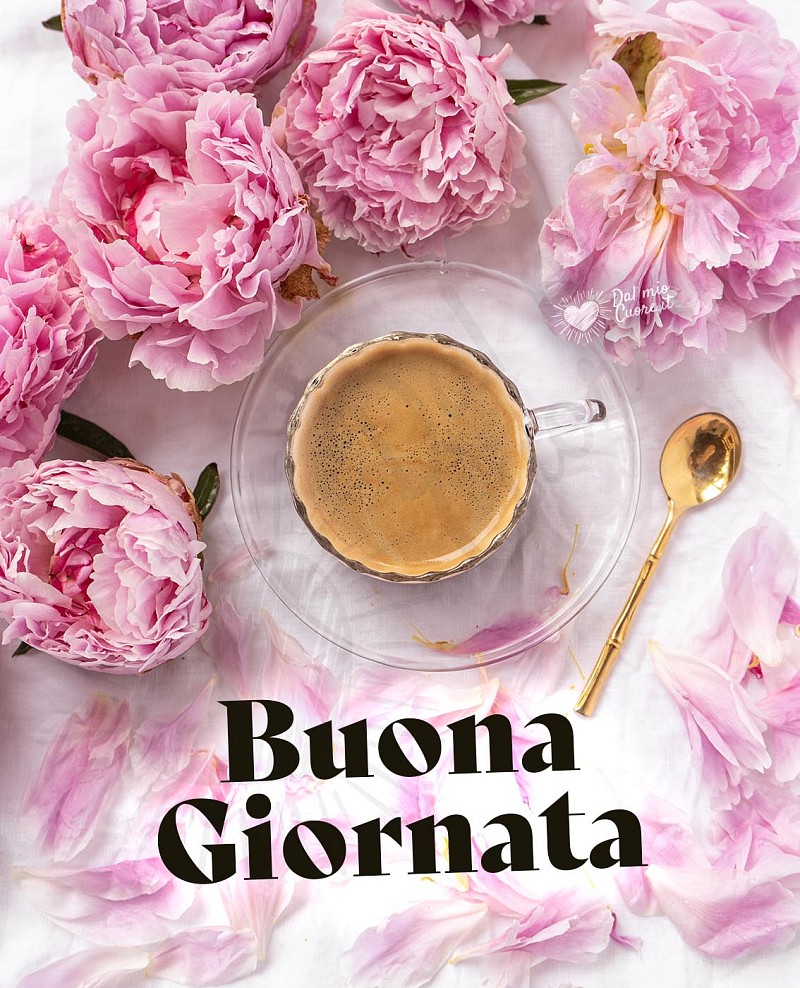 Buona giornata con tazzina di caffè e fiori